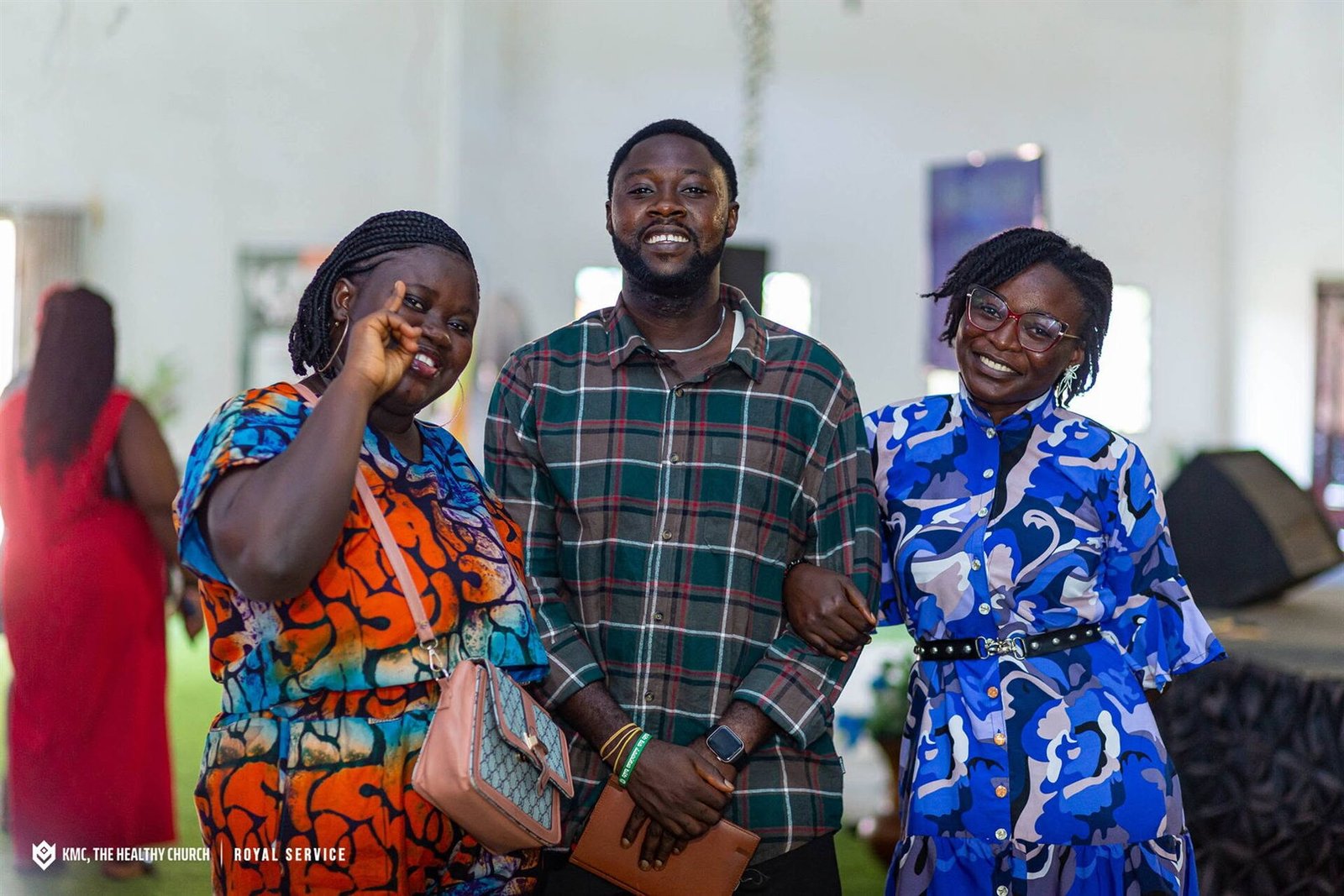 Members of KMC, The Healthy Church laughing together during a service